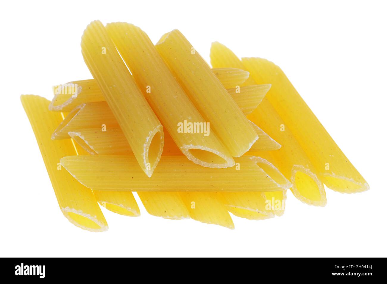 Dry small pasta in the form of short  tubes . Isolated on white macro Stock Photo