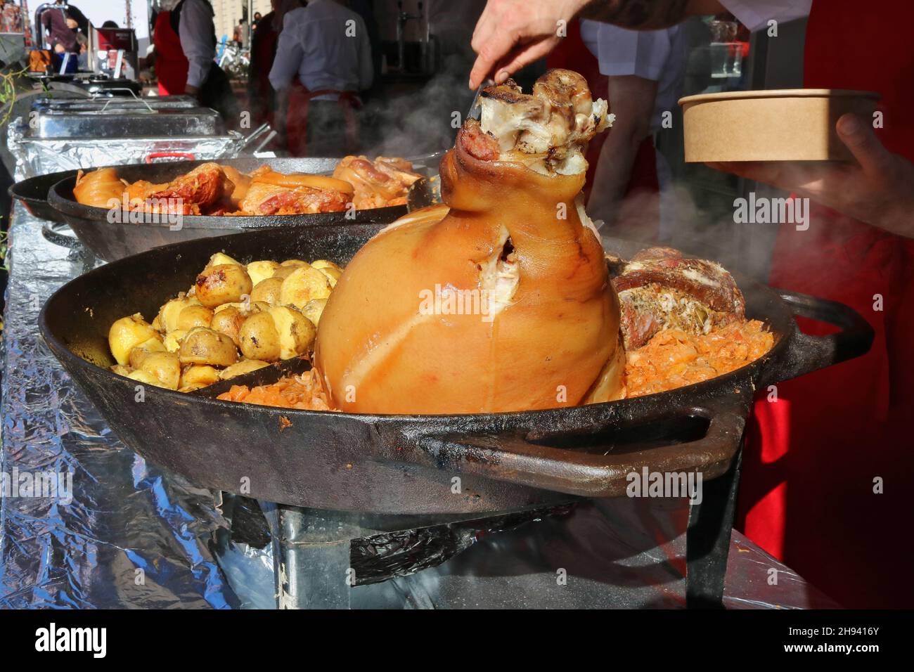 Street food - braised pork knuckle with potatoes and  cabbage Stock Photo