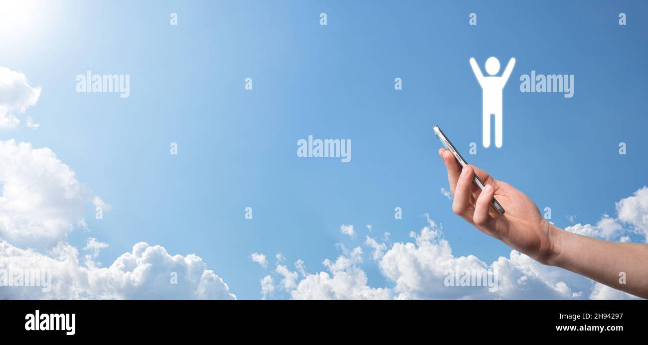 Hand on sky background holds human icon Stock Photo - Alamy
