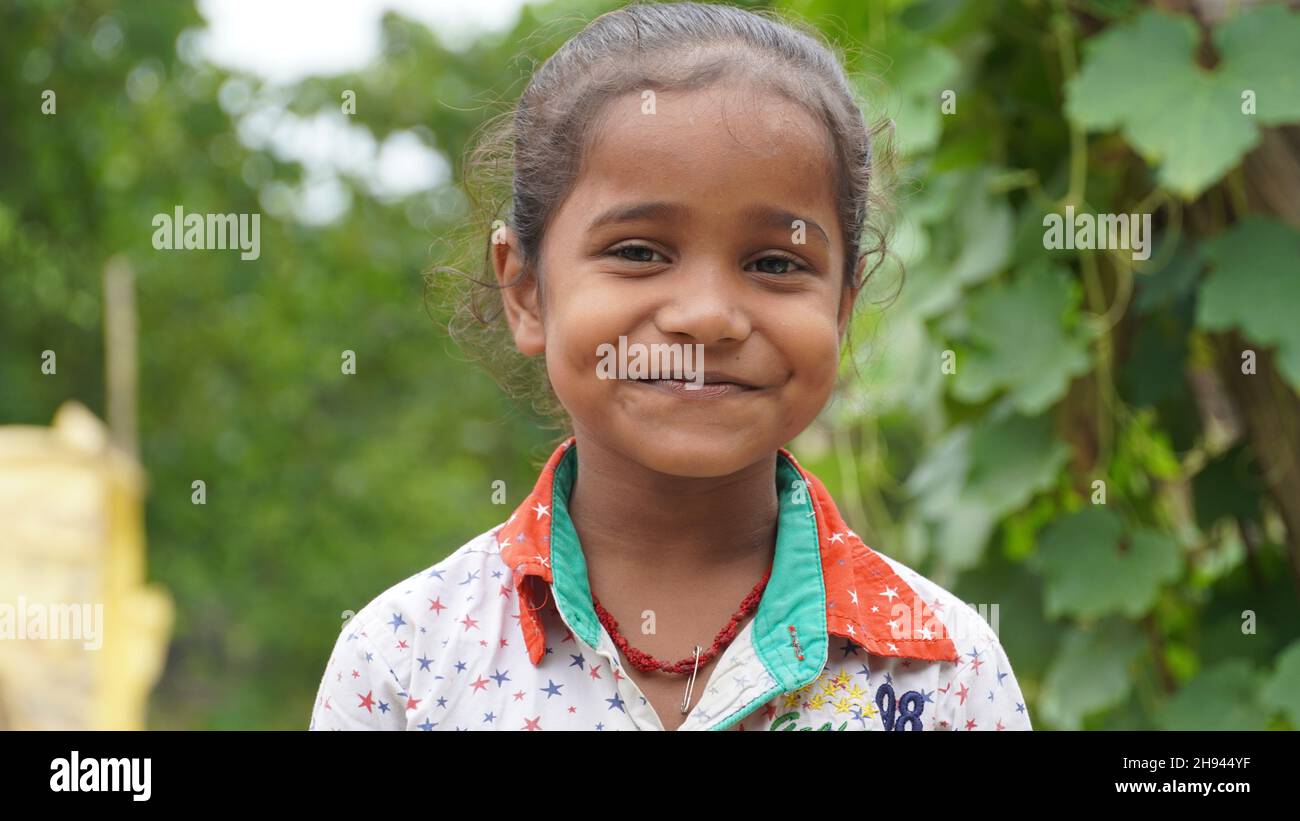 Portrait of little excited shocked crazy smiling girl in village Stock Photo