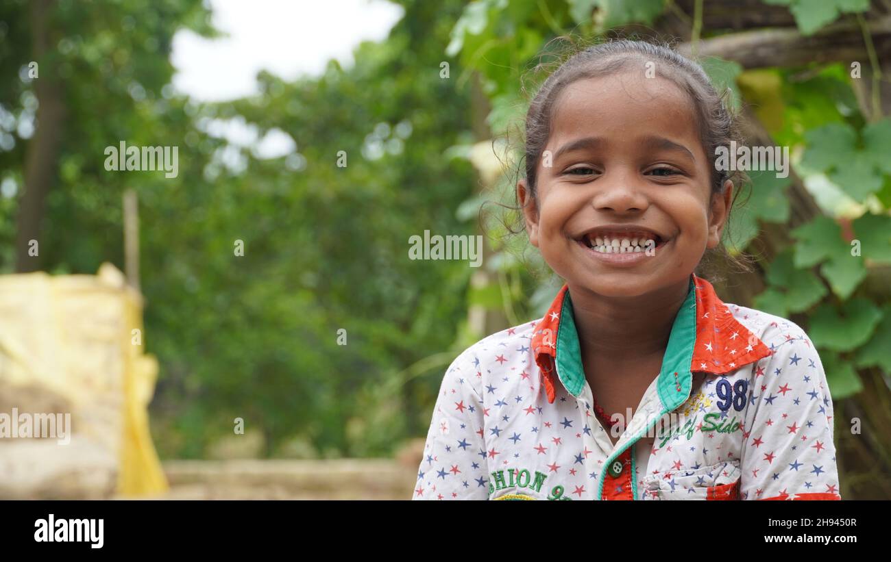 Portrait of little excited shocked crazy smiling girl in village Stock Photo