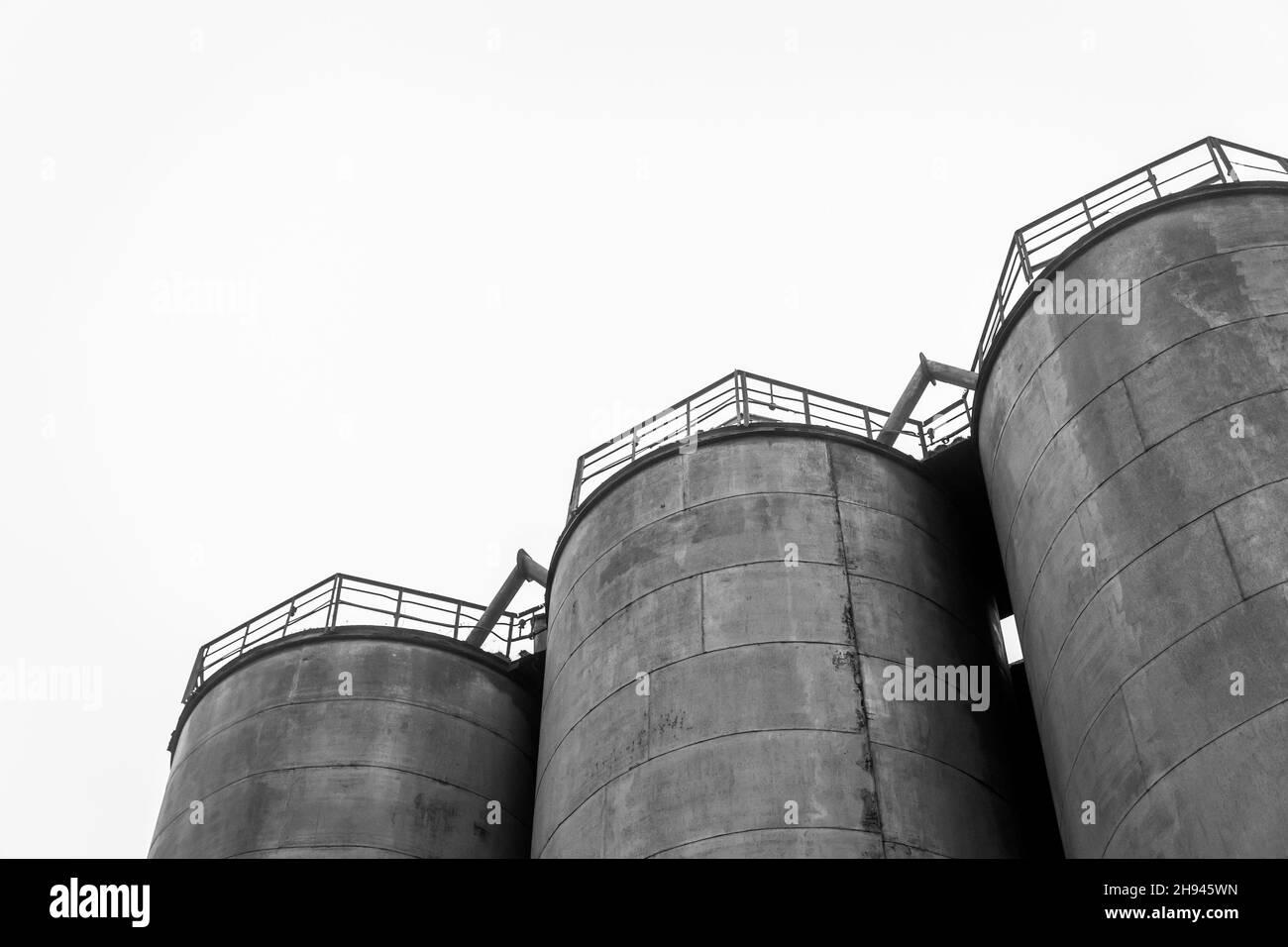 Fuel old chemical tank fertilizer barrel oil in an industrial abandoned plant. Stock Photo
