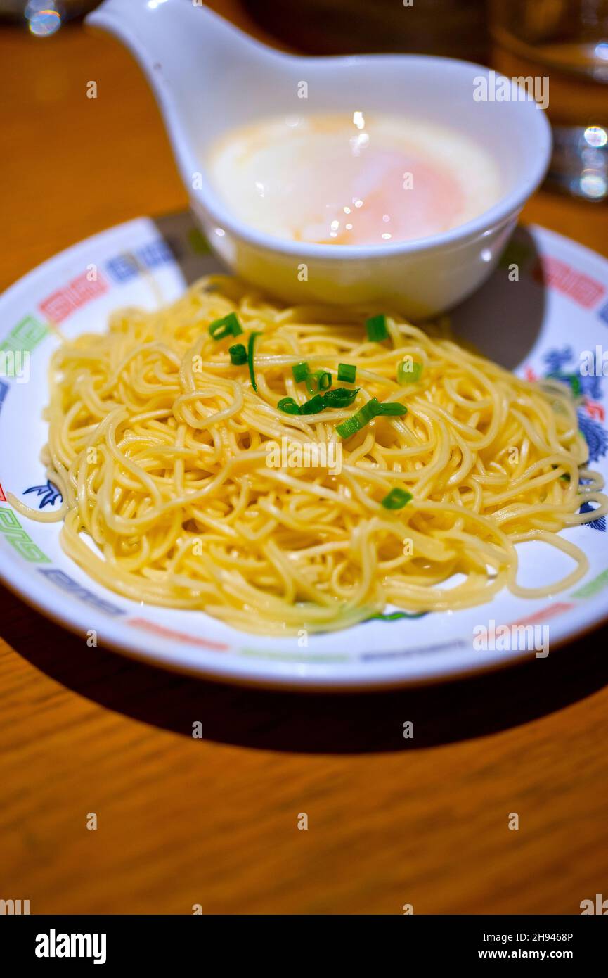 traditional Japanese ramen noodles with poached egg on the side Stock