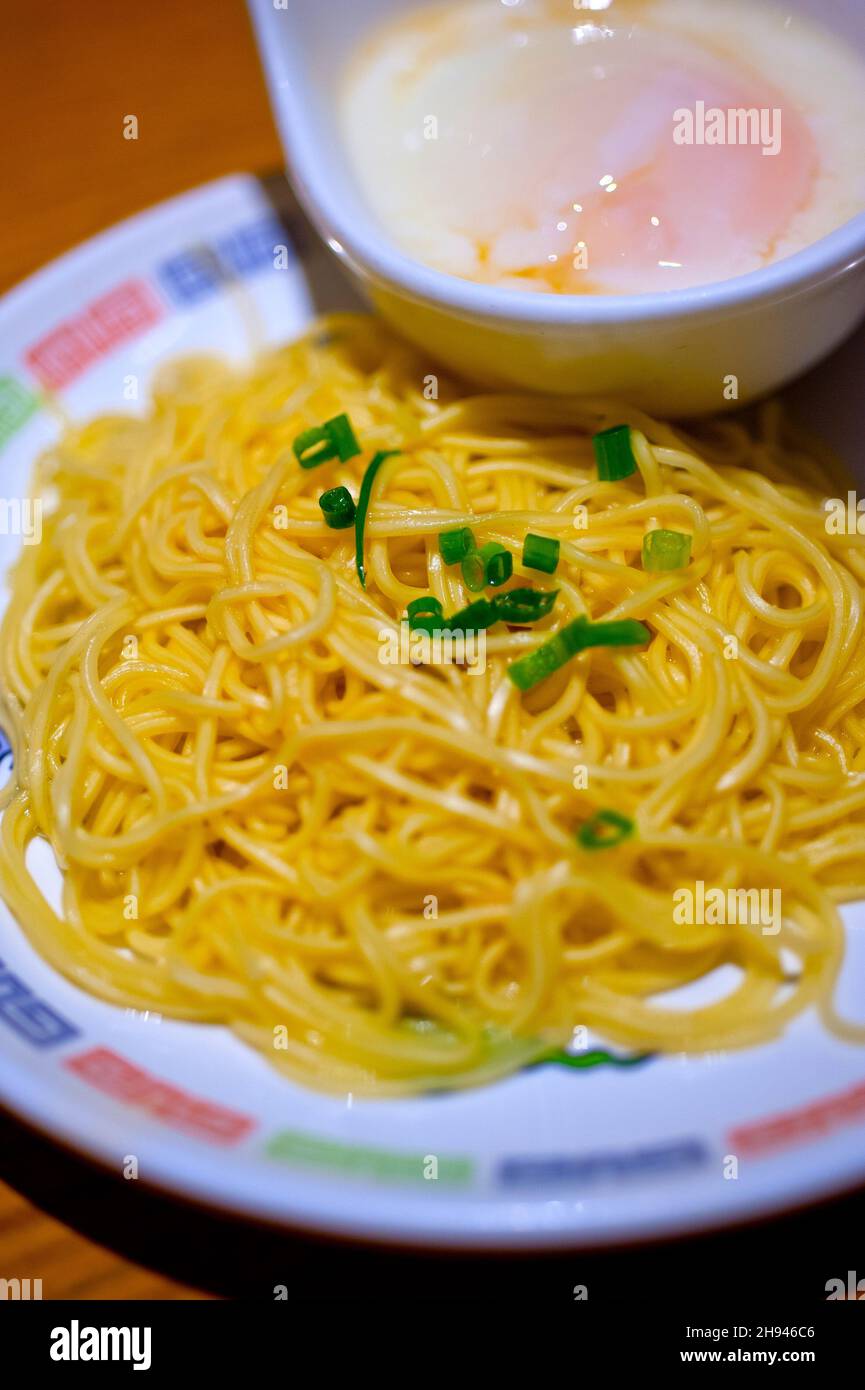 traditional Japanese ramen noodles with poached egg on the side Stock