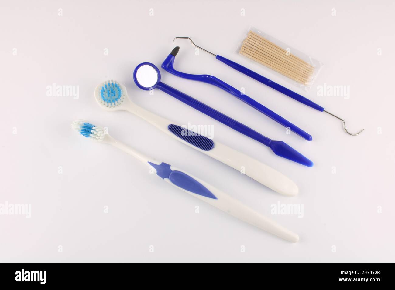 Toothbrush, tongue brush, mirror, pick, stain eraser and toothpicks