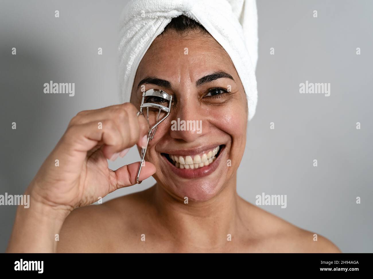 Happy Latin Mature Woman Using Eyelash Curler People Beauty And Wellness Lifestyle Concept