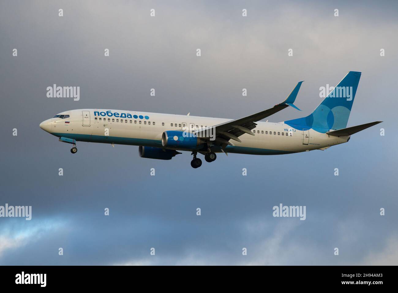 SAINT PETERSBURG, RUSSIA - OCTOBER 28, 2020: Flying Boeing 737-800 (VQ-BTJ) aircraft of Pobeda Airlines against the background of the cloudy sky Stock Photo