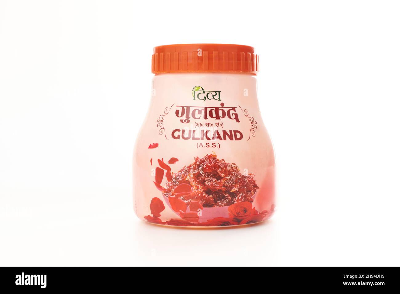 Kaliningrad, Russia - 09.11.2021 - Gulkand bottle, sweet preserve of rose petals isolated on white background. Indian cooked mixture for use in Unani Stock Photo