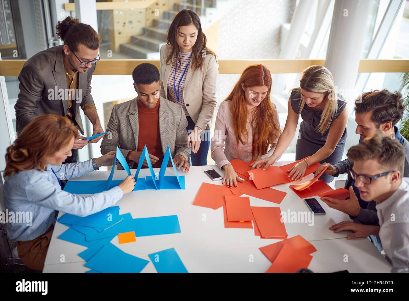 Group of multiethnic colleagues having fun in the office; Team building concept Stock Photo