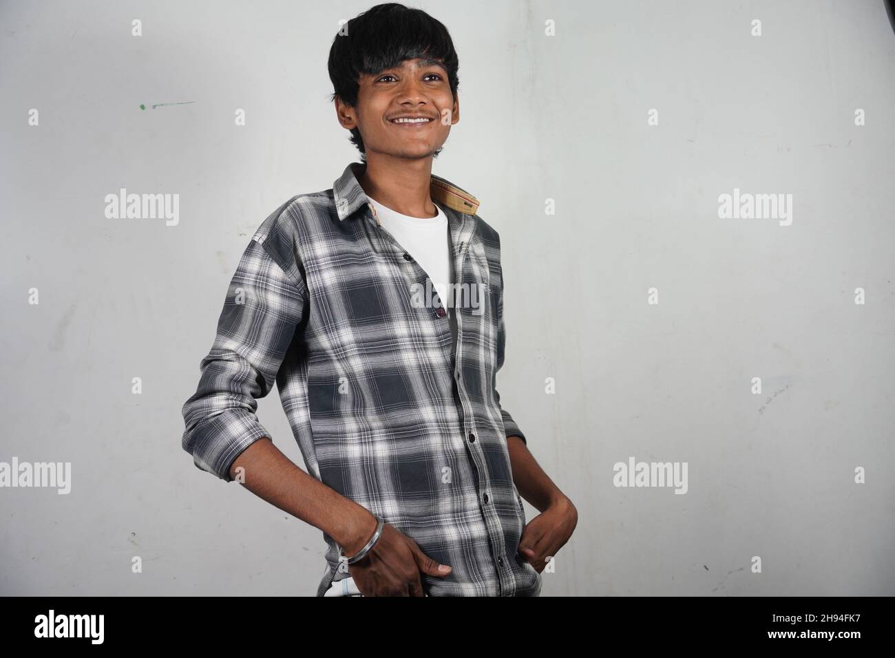 Young man smile looking down indian hi-res stock photography and images ...