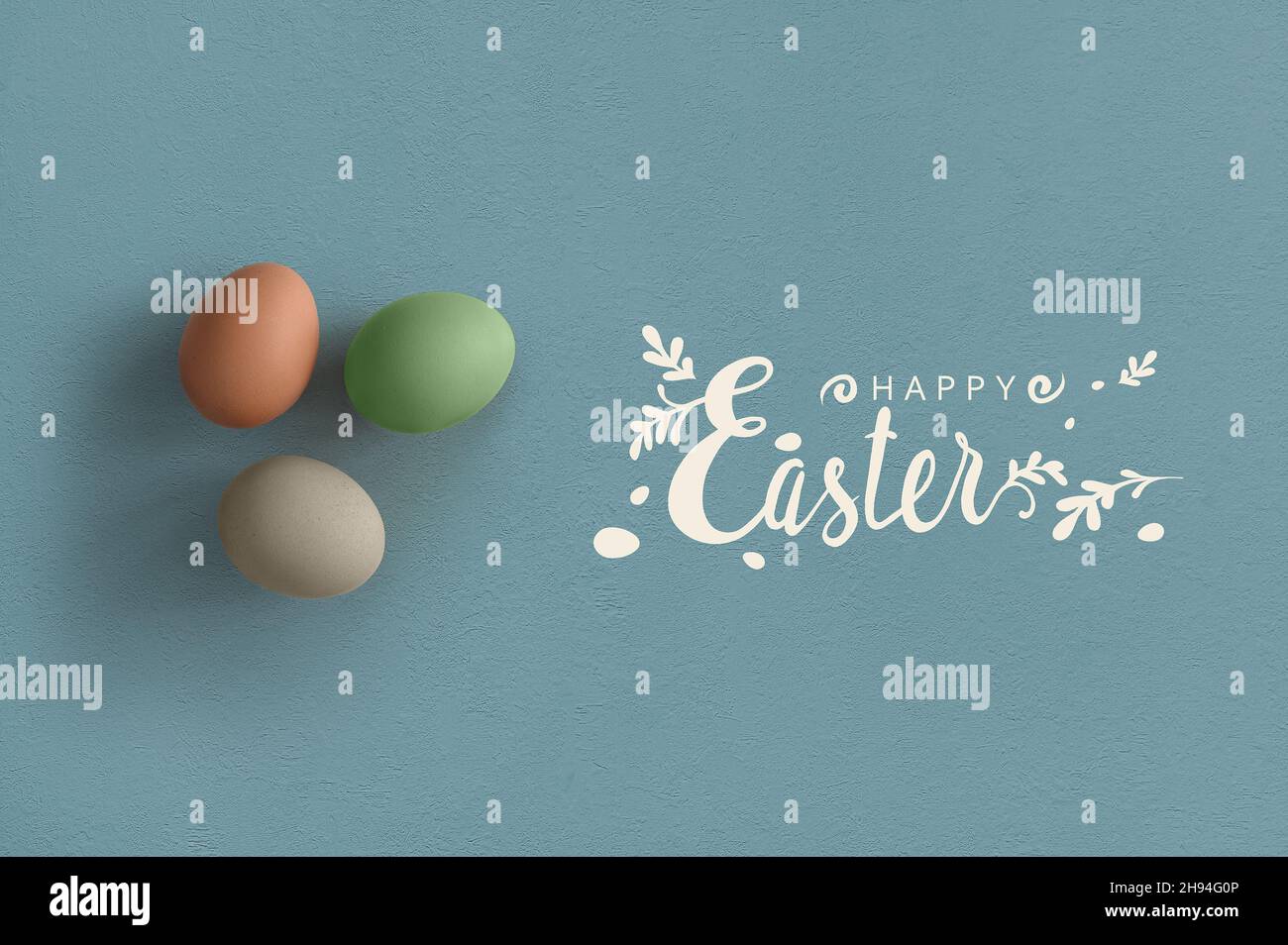 Colorful eggs top view with happy Easter lettering Stock Photo