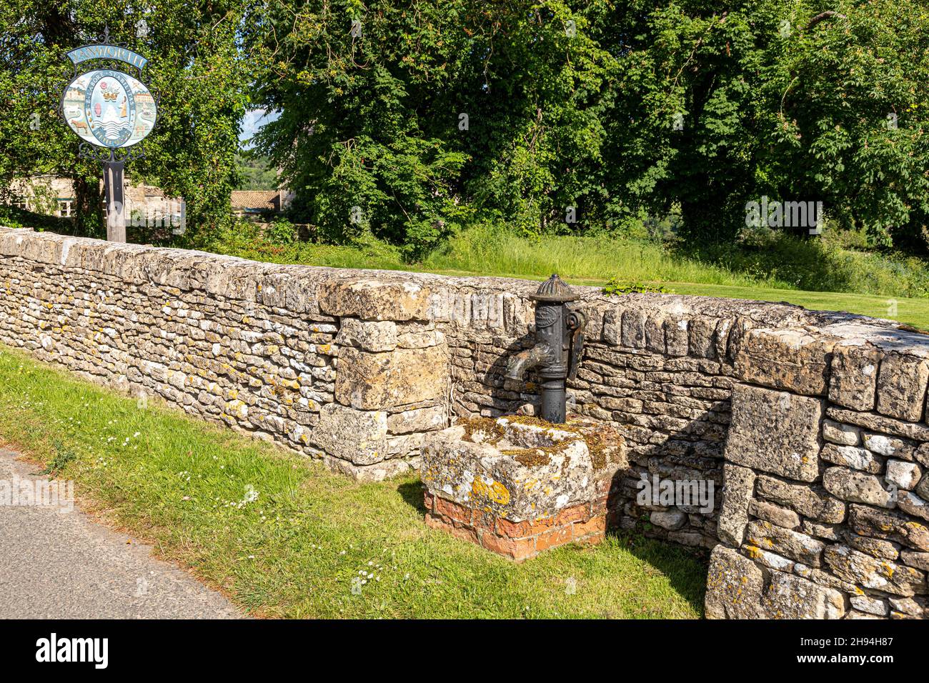 The old village water pump in the Cotswold village of Yanworth, Gloucestershire UK Stock Photo