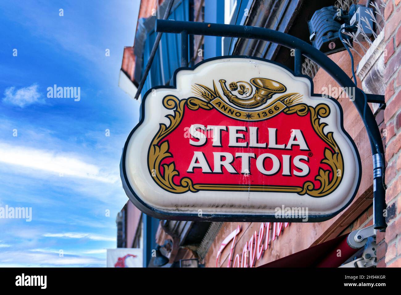 Advertising sign of Stella Artois beer on a business entrance wall. Nov. 22, 2021 Stock Photo