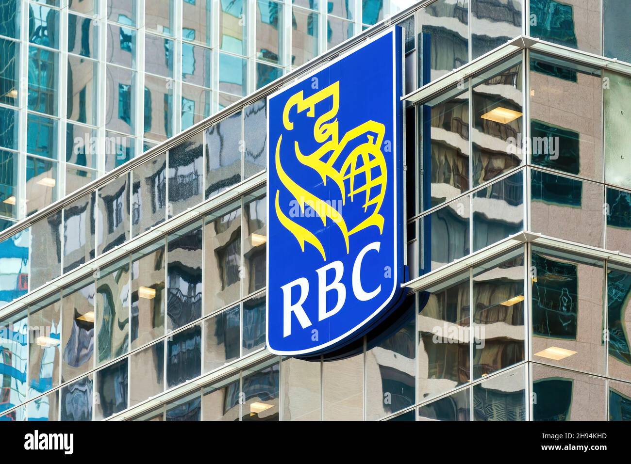 RBC or Royal Bank of Canada logo seen on the glass facade of a modern building. Nov. 22, 2021 Stock Photo
