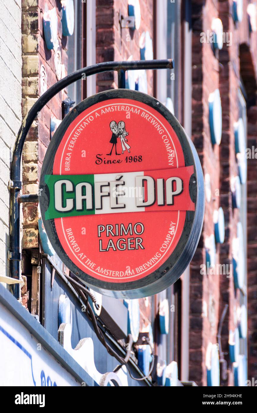 Oval vintage sign reading Cafe Dip Primo Lager seen in the Little Italy district. Nov. 22, 2021 Stock Photo