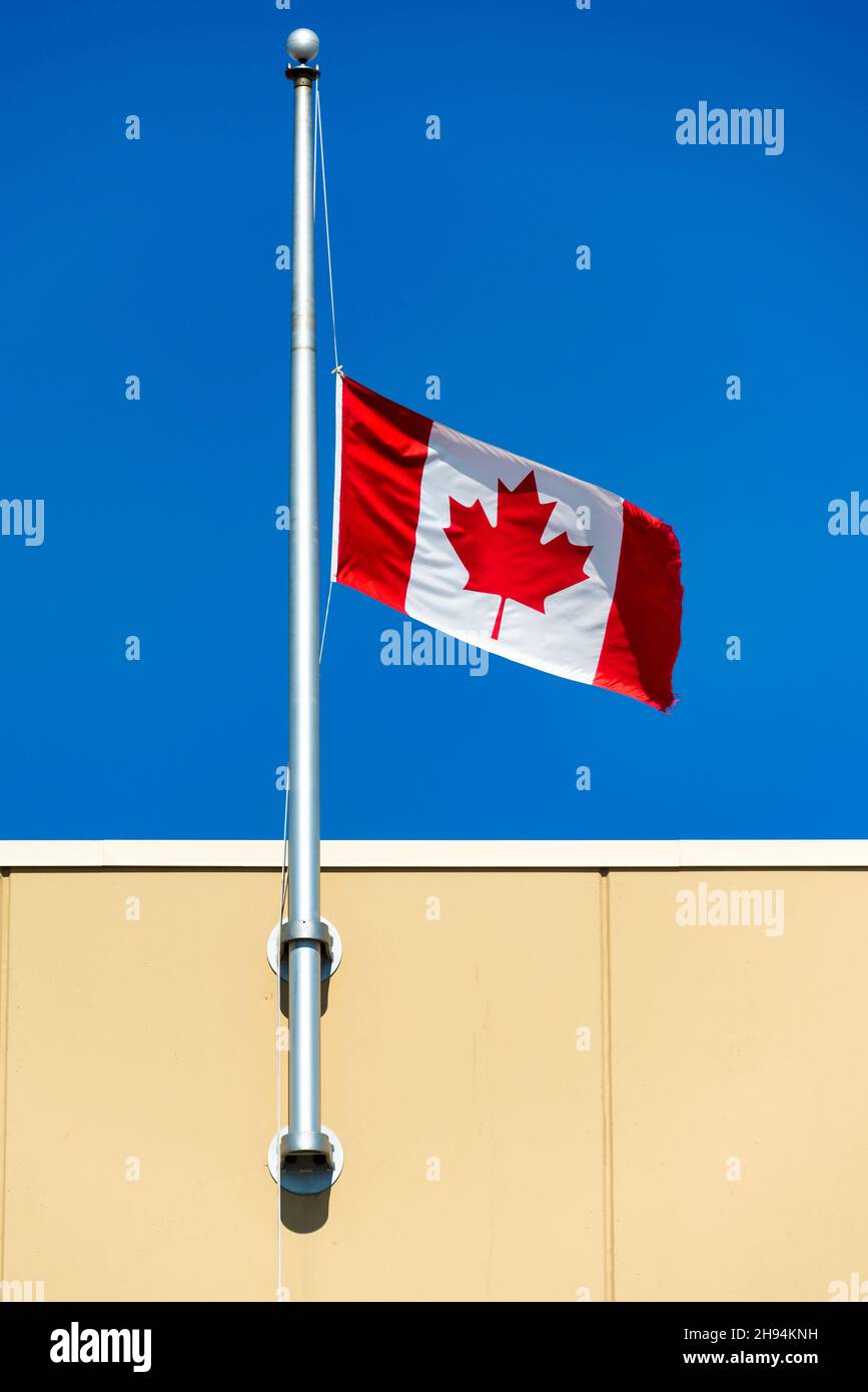 Canadian national flag flying at half mast as part of the reconciliation process between the government and the First NationsNov. 22, 2021 Stock Photo