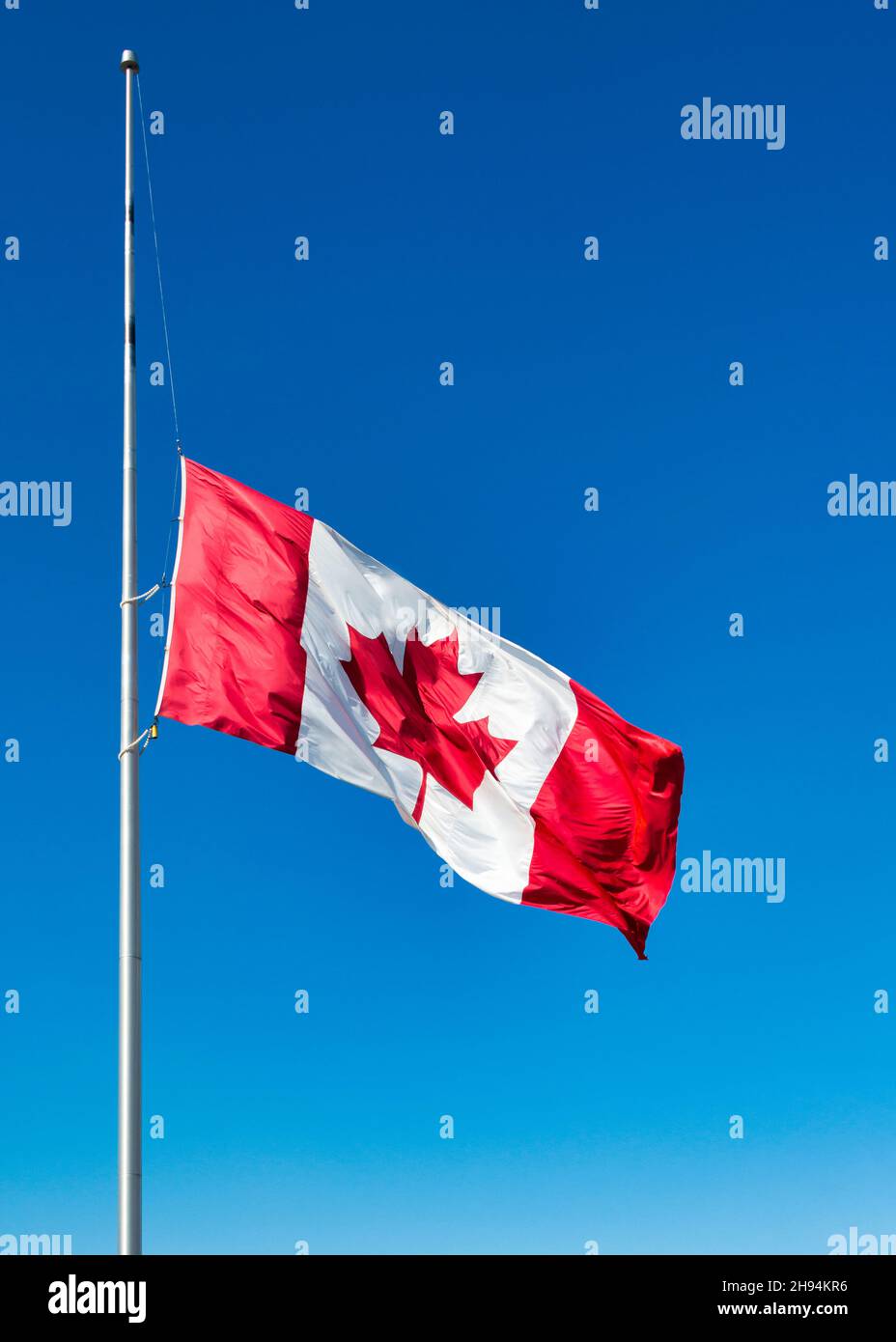 Canadian national flag flying at half mast as part of the reconciliation process between the government and the First NationsNov. 22, 2021 Stock Photo