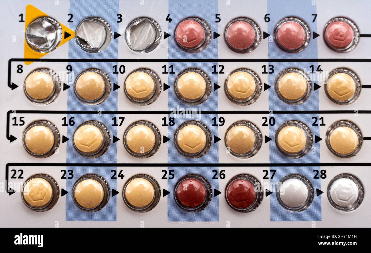 Contraceptive pills of different colors close-up for daily use. Cotraception. Woman's health Stock Photo