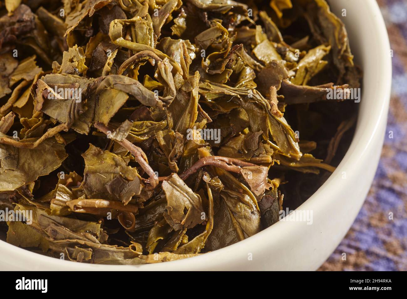 steeped green tea leaves, for Burmese Tea Leaf Salad, or Lahpet Thoke. Stock Photo