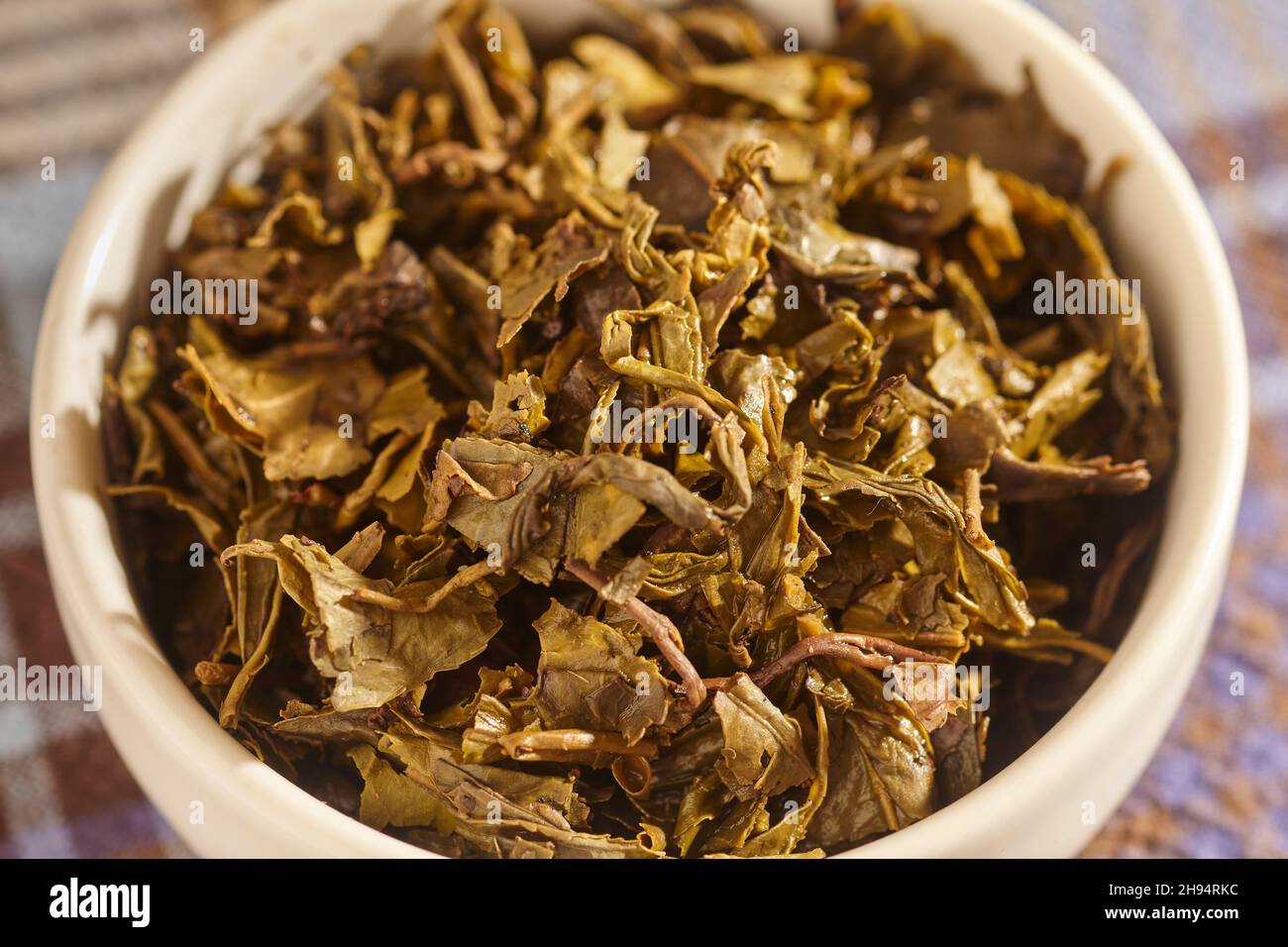 steeped green tea leaves, for Burmese Tea Leaf Salad, or Lahpet Thoke. Stock Photo
