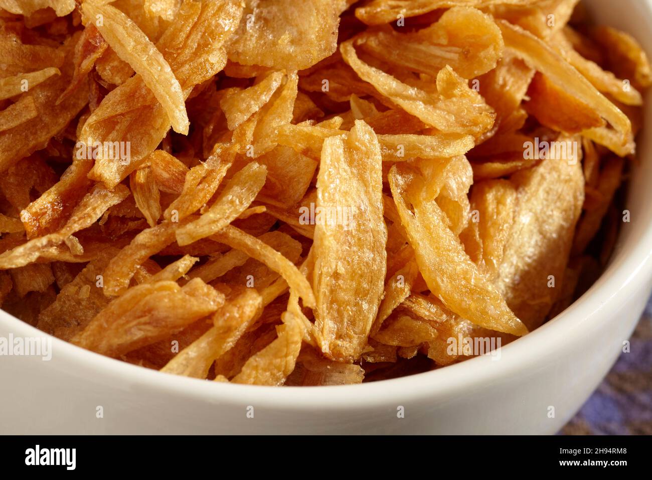 Chips of fried red onion Stock Photo