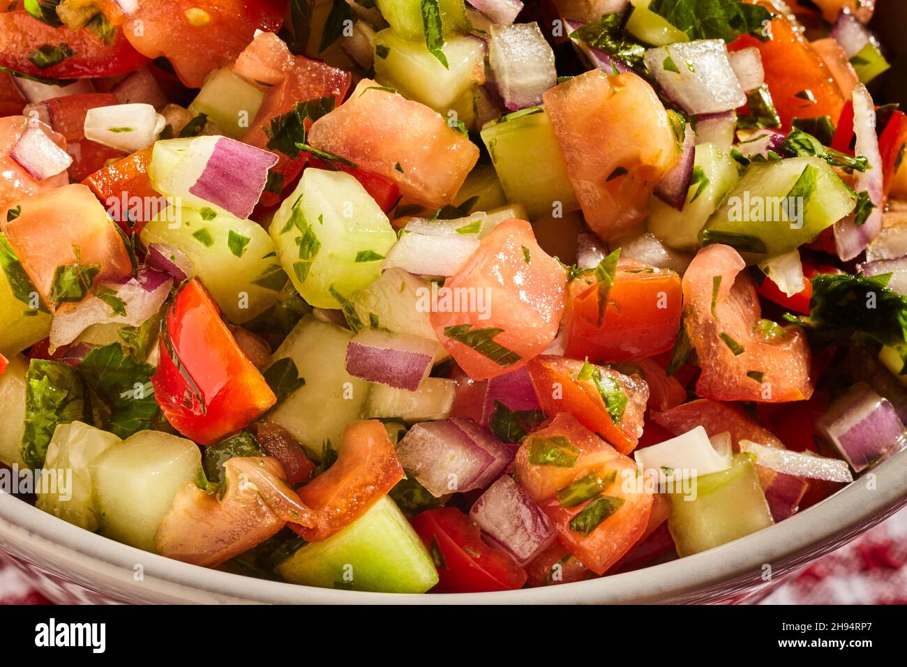 A bowl of Israeli Salad, sometimes called 'chopped salad.' Stock Photo