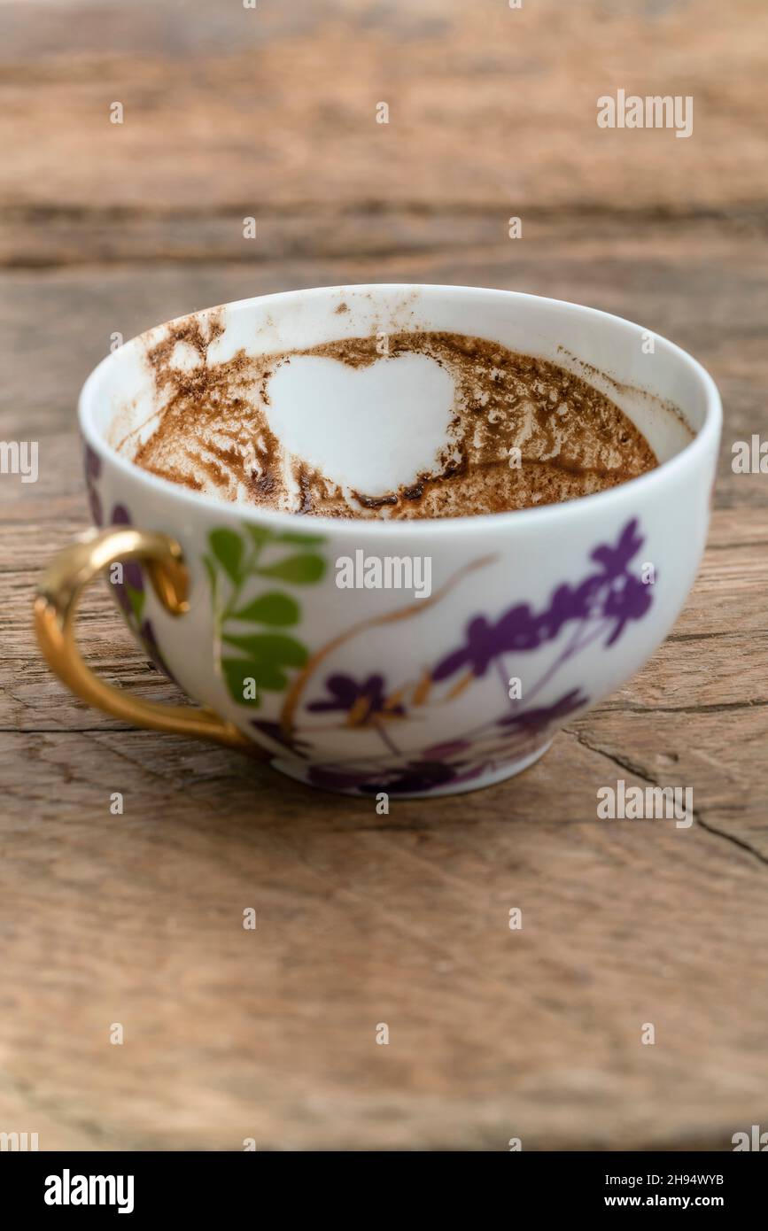 Coffee grounds, heart shape in Turkish coffee grounds in cup for