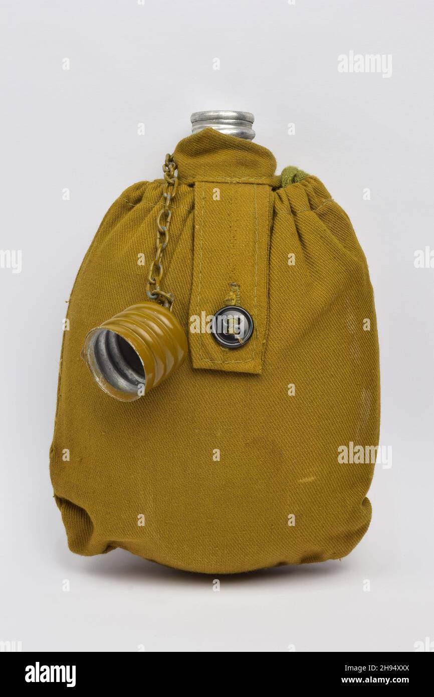 Military khaki lined liquid flask with open lid on chain on white clipping background Stock Photo