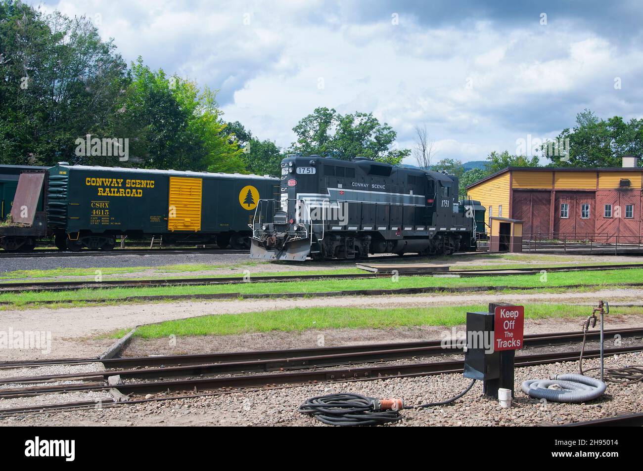 North Conway, New Hampshire. September 2, 2018. A vintage black diesel and box car at