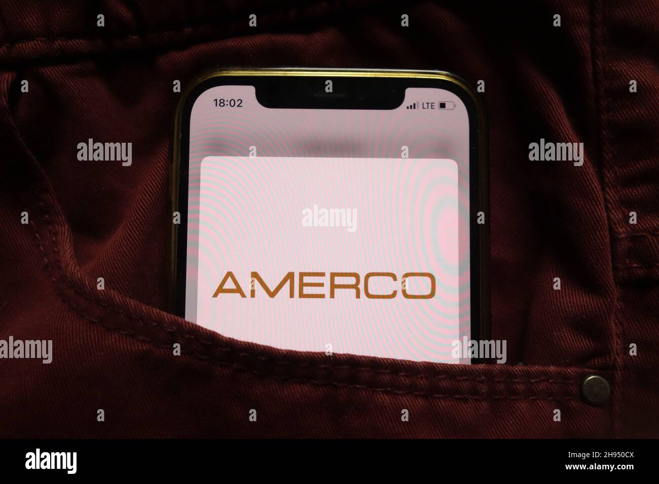 KONSKIE, POLAND - September 15, 2021: Amerco company logo displayed on mobile phone hidden in jeans pocket Stock Photo