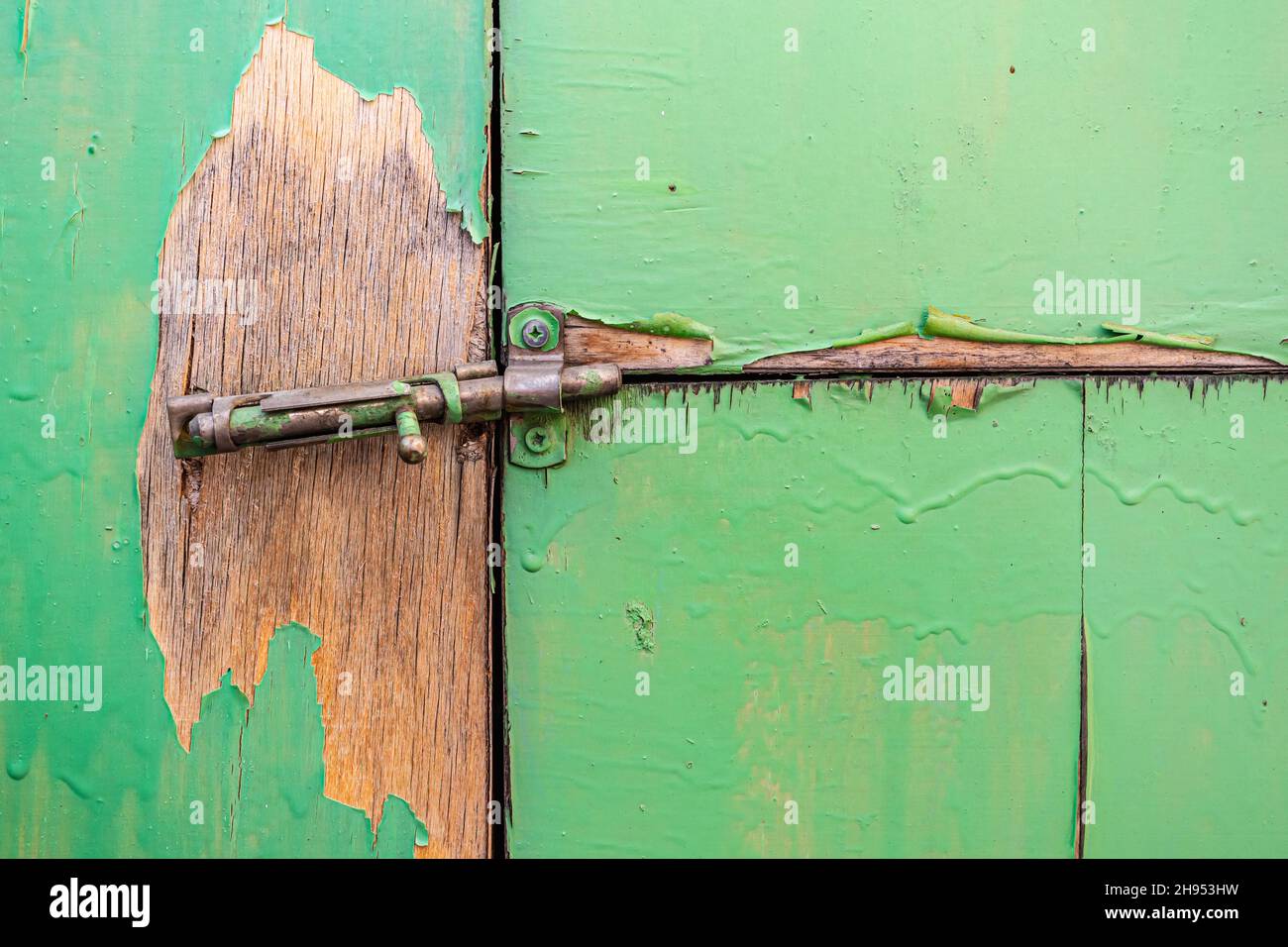 Broken latch closeup not tightly locking ramshackle doors of an old barn Stock Photo Alamy