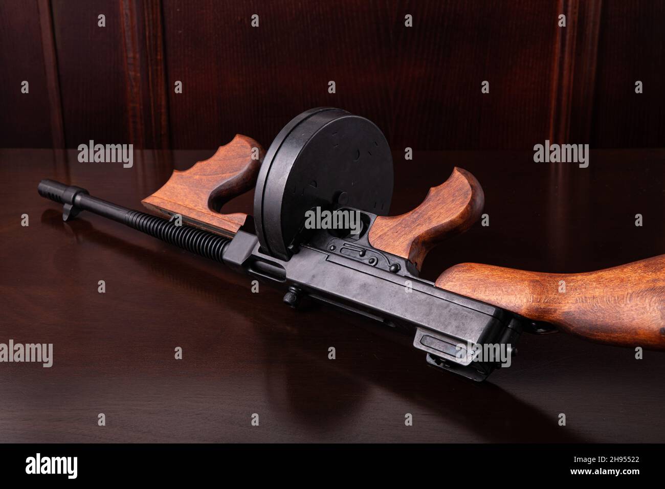 Thompson submachine gun on a dark table vintage style background photography Stock Photo