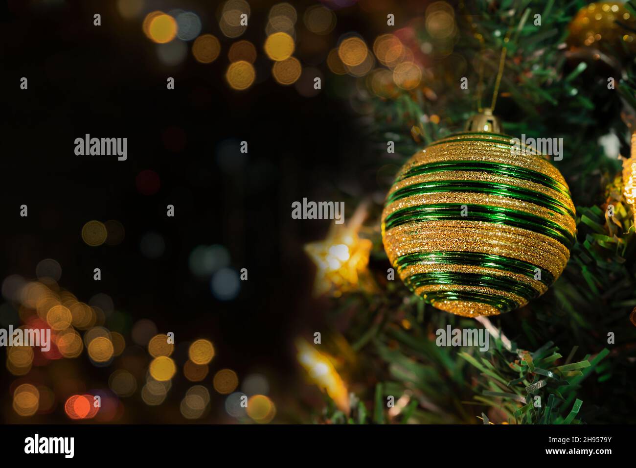 Christmas tree with decorations and lights background Stock Photo