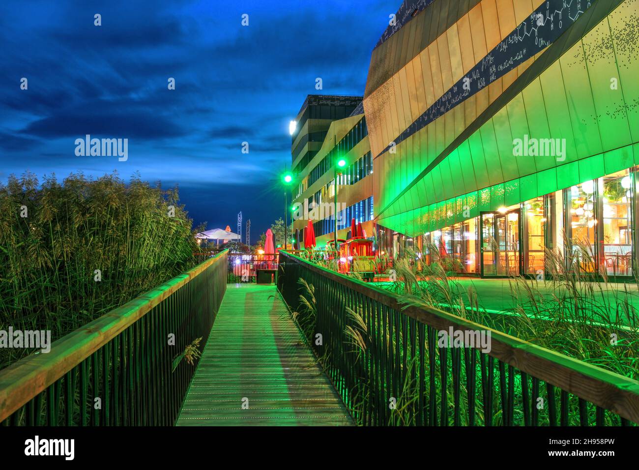 Night scene in the Y-Parc Technopole in Yverdon-les-Bains, Switzerland with the newest addition, Exploreit building (2021) by architect Philippe Gilli Stock Photo