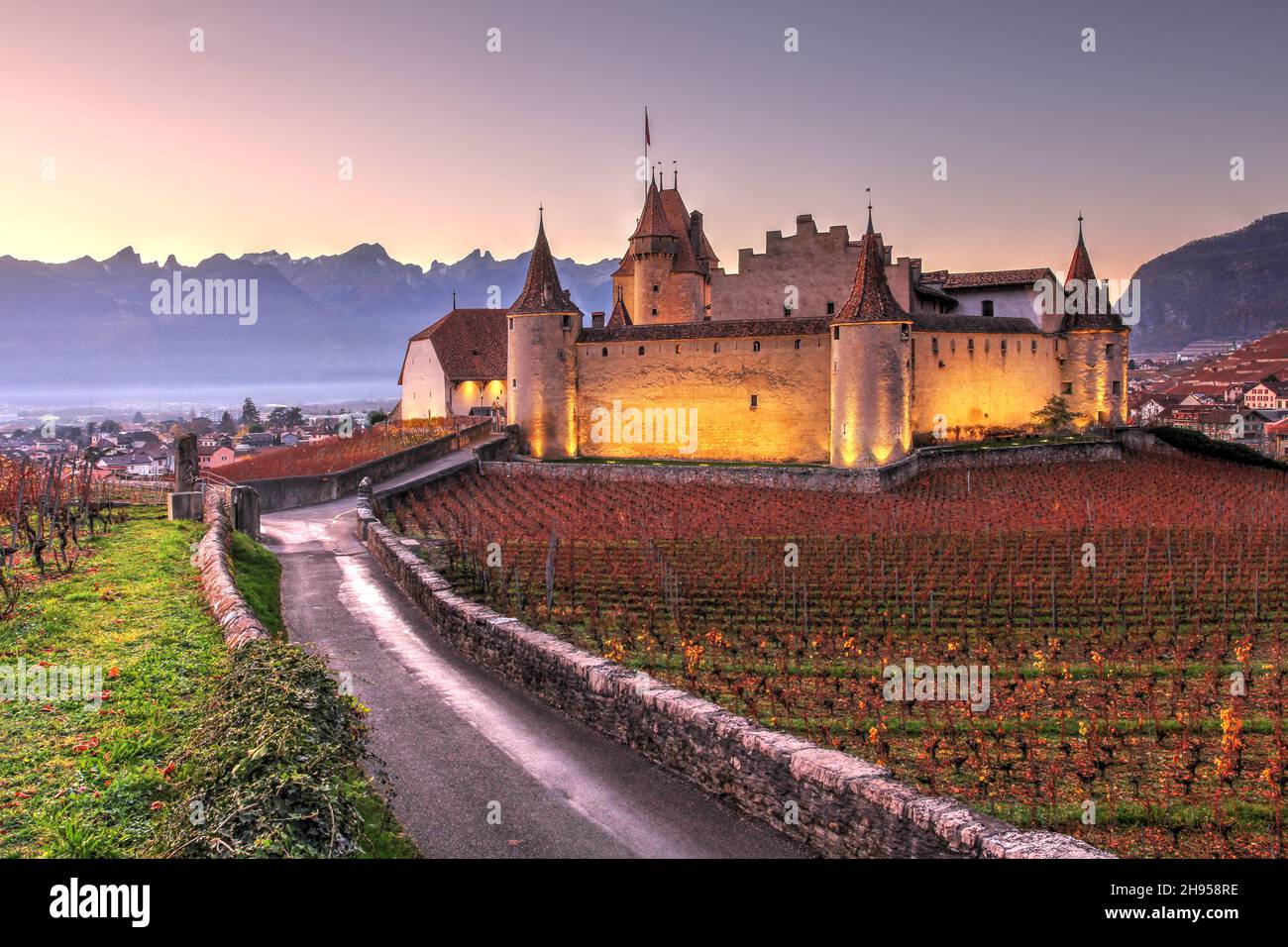 Chateau d'Aigle sits among world famous vineyards guarding the entrance to Rhone valley at the border between Canton de Vaud and Valais in Switzerland Stock Photo