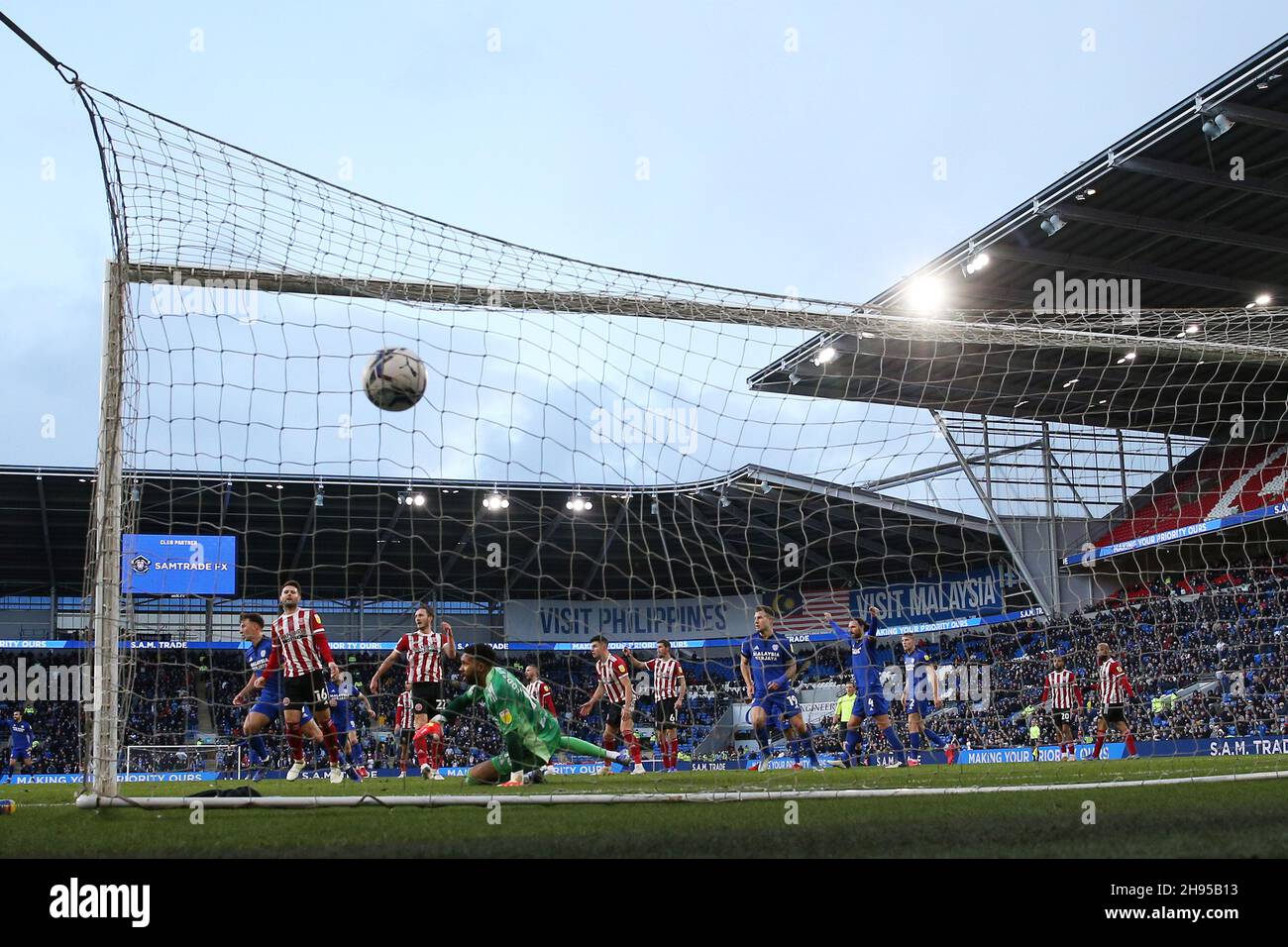 Cardiff, UK. 04th Dec, 2021. Mark Harris of Cardiff city scores his teams 1st goal. EFL Skybet championship match, Cardiff city v Sheffield United at the Cardiff City Stadium in Cardiff, Wales on Saturday 4th December 2021. this image may only be used for Editorial purposes. Editorial use only, license required for commercial use. No use in betting, games or a single club/league/player publications. pic by Andrew Orchard/Andrew Orchard sports photography/Alamy Live news Credit: Andrew Orchard sports photography/Alamy Live News Stock Photo