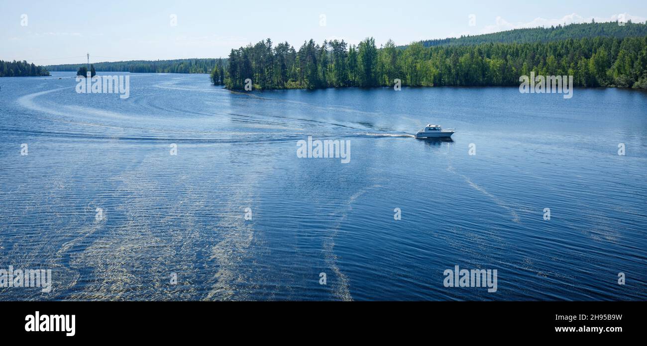Motorboat at Southern Konnevesi National Park ( lake Etelä-Konnevesi , Kivisalmi ) at Summer , Finland Stock Photo