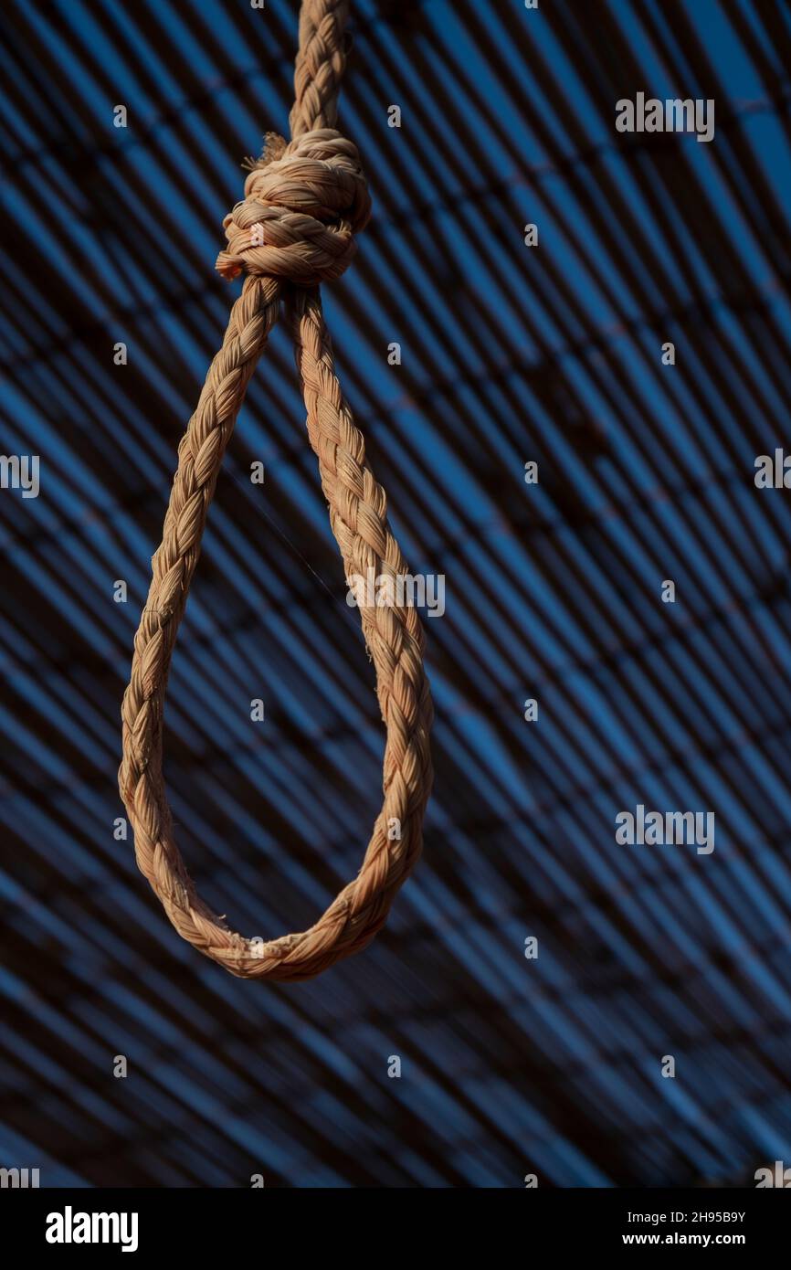 Rope noose on blue background Stock Photo