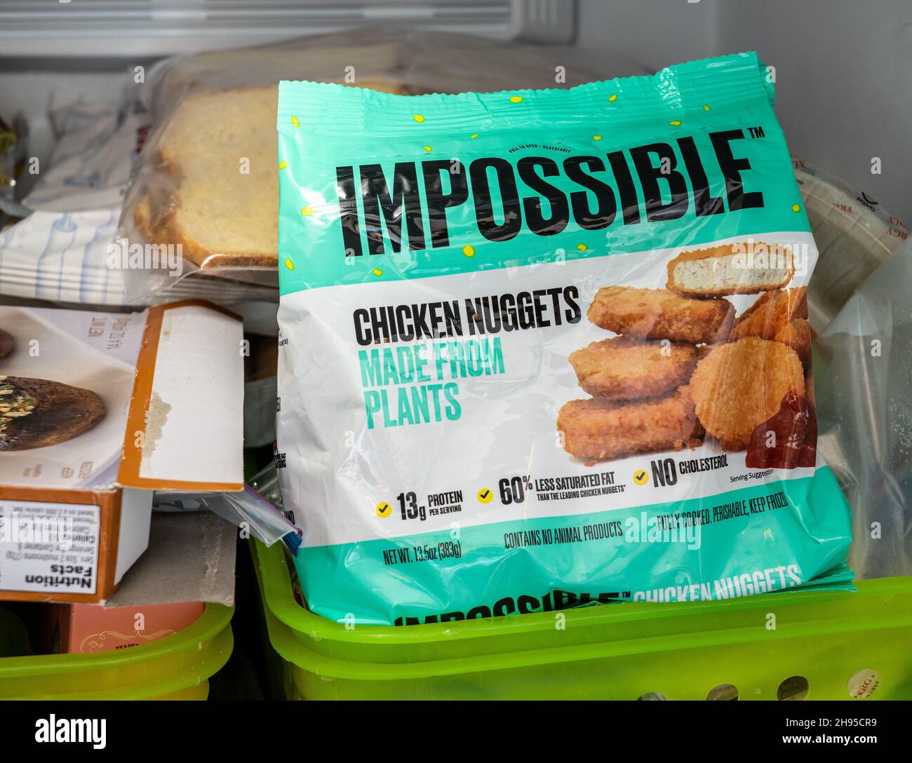 MORGANTOWN, WV - 4 November 2021: Packaging for Impossible Foods chicken nuggets made from plants inside domestic freezer Stock Photo