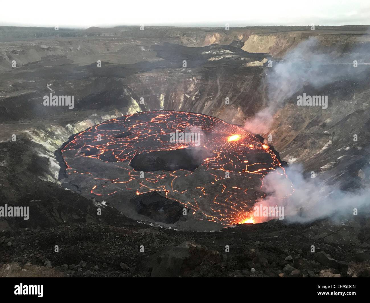 Kapoho, United States of America. 02 October, 2021. Lava continues to erupt from multiple vents on the base and west wall of Halemaumau, at Kilauea summit inside Hawaii Volcanoes National Park, October 2, 2021 in Kapok, Hawaii. Lava fountaining at multiple fissure locations on the base and west wall of the crater continued, and a lava lake is growing within the volcanic crater.  Credit: Liliana DeSmither/USGS/Alamy Live News Stock Photo