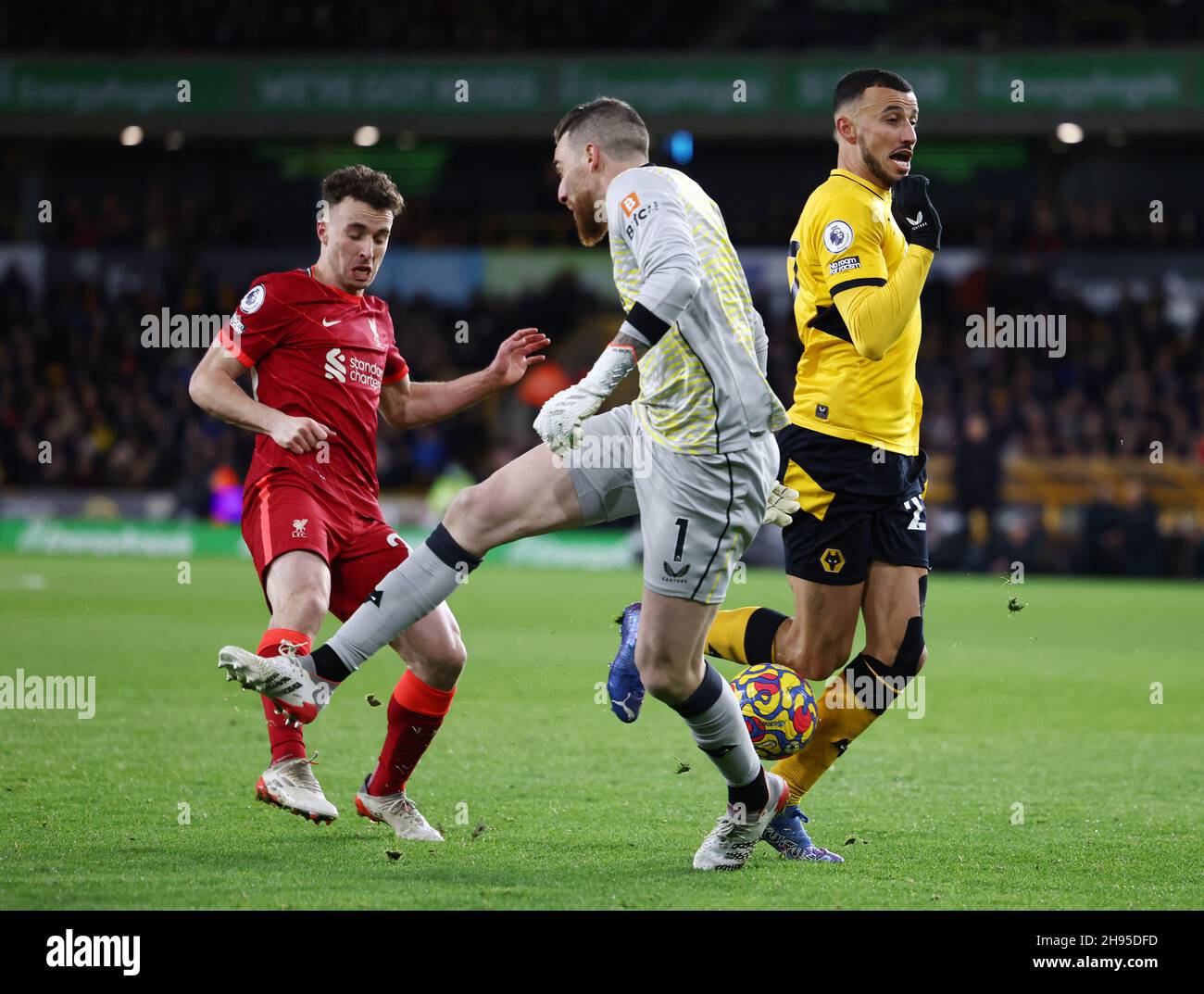 Wolverhampton, England, 4th December 2021. Jose Sa of Wolverhampton Wanderers comes rushing out and collides with Romain Saiss of Wolverhampton Wanderers leaving Diogo Jota of Liverpool with a free shot on goal  during the Premier League match at Molineux, Wolverhampton. Picture credit should read: Darren Staples / Sportimage Credit: Sportimage/Alamy Live News Stock Photo
