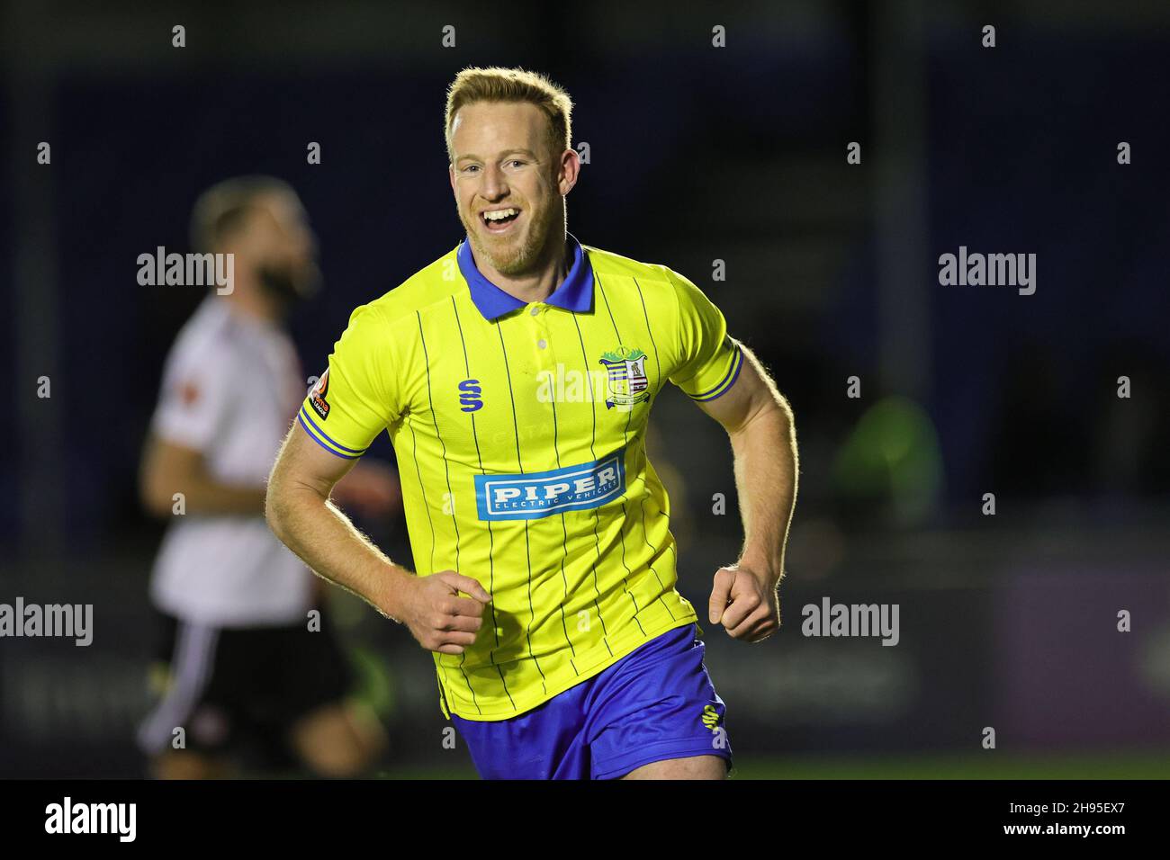 SOLIHULL, ENGLAND. DECEMBER 4TH 2021. Adam Rooney of Solihull Moors celebrates after scoring their teams second goal during the Vanarama National League match between Solihull Moors and Woking FC at the Armco Stadium, Solihull on Saturday 4th December 2021. (Credit: James Holyoak/Alamy Live News) Stock Photo