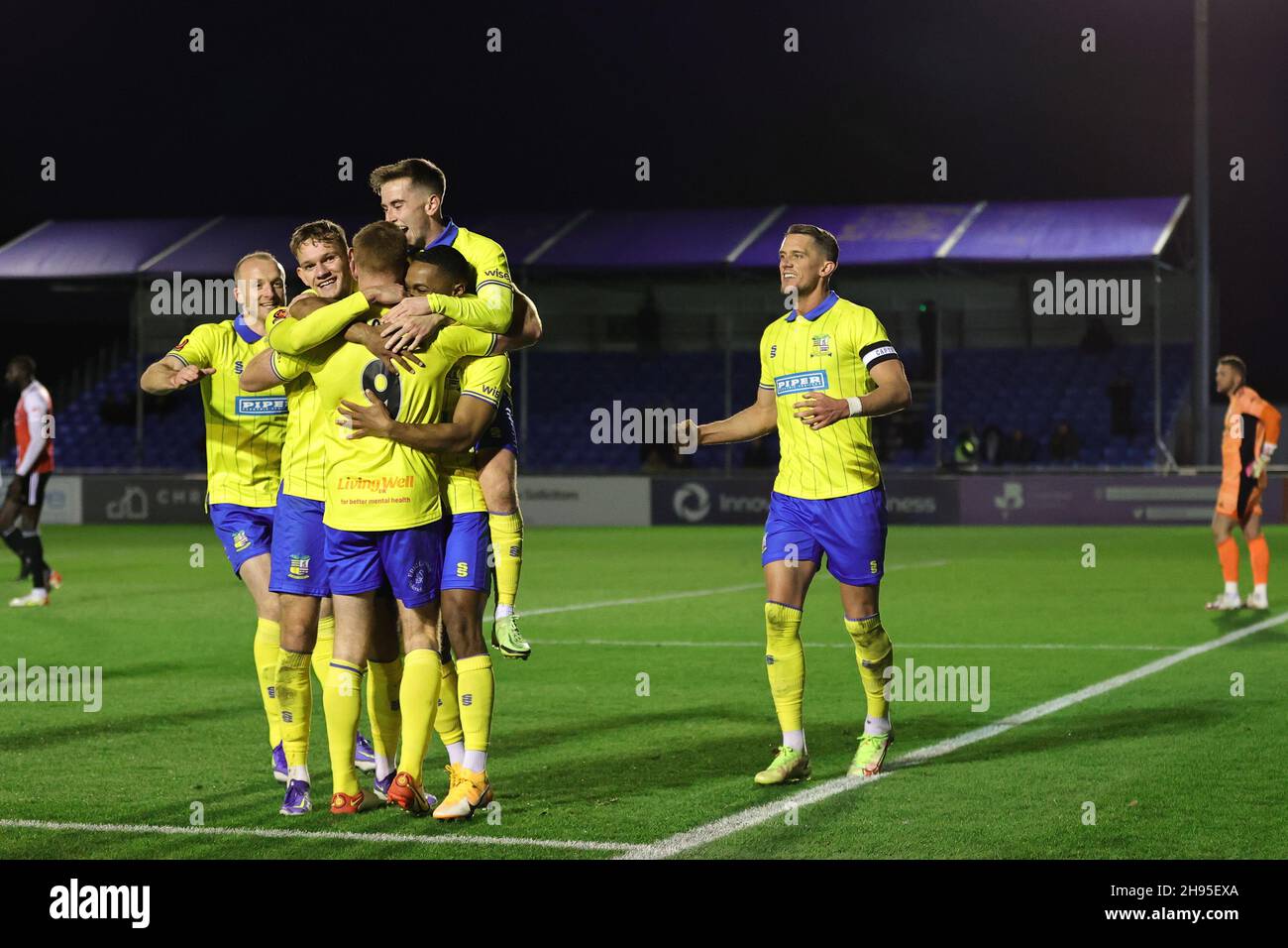 SOLIHULL, ENGLAND. DECEMBER 4TH 2021. Adam Rooney of Solihull Moors (9) celebrates with teammates after scoring their teams second goal during the Vanarama National League match between Solihull Moors and Woking FC at the Armco Stadium, Solihull on Saturday 4th December 2021. (Credit: James Holyoak/Alamy Live News) Stock Photo