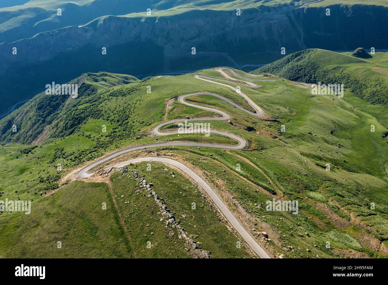 Winding road passing through mountain Stock Photo