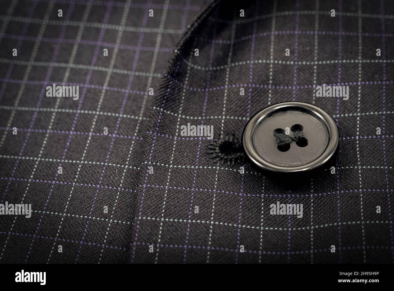 A button on a man's suit close-up. Element of men's clothing. Buttons ...