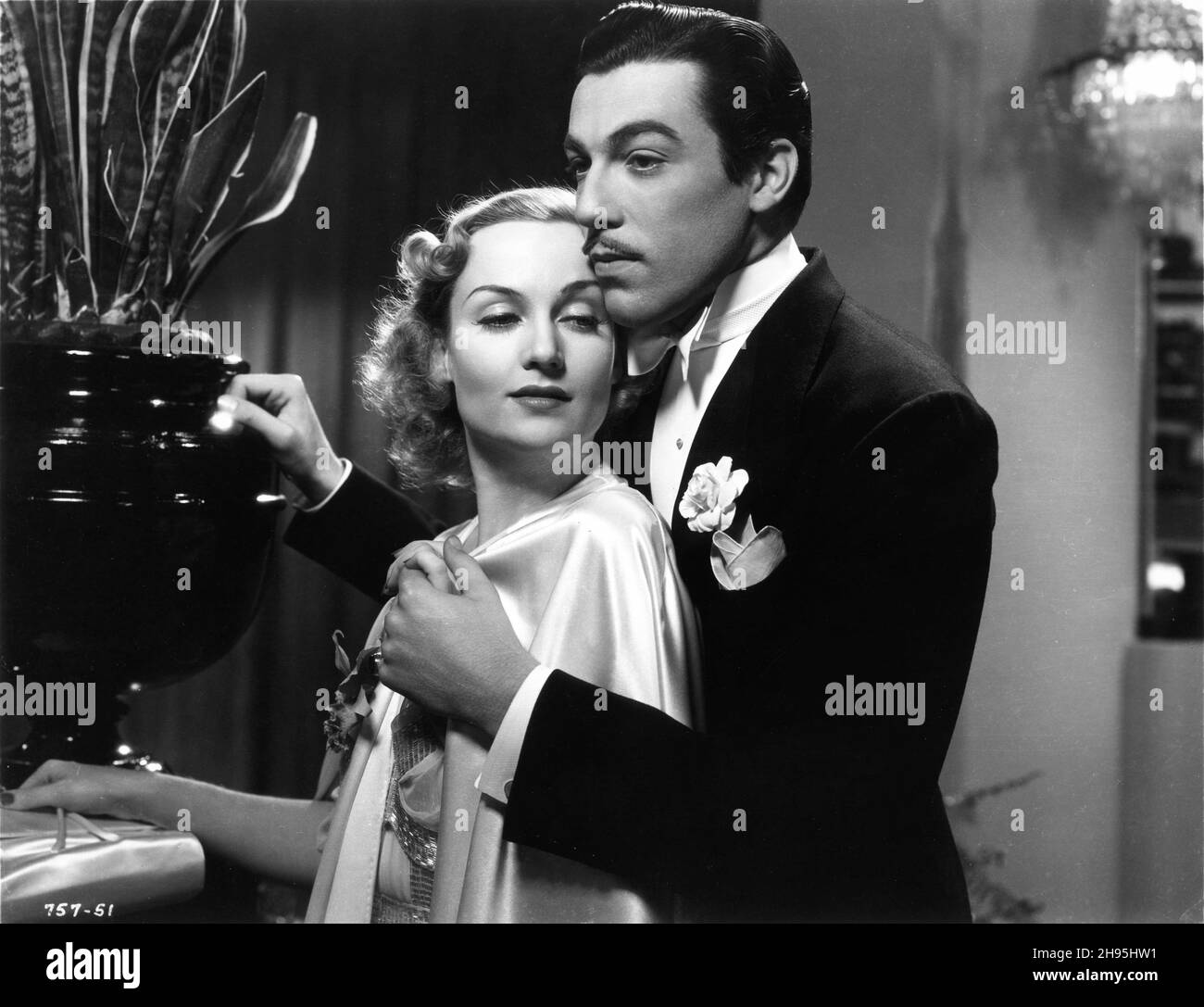 CAROLE LOMBARD and CESAR ROMERO in LOVE BEFORE BREAKFAST 1936 director WALTER LANG from the novel Spinster Dinner by Faith Baldwin music Franz Waxman Miss Lombard's gowns Travis Banton Universal Pictures Stock Photo