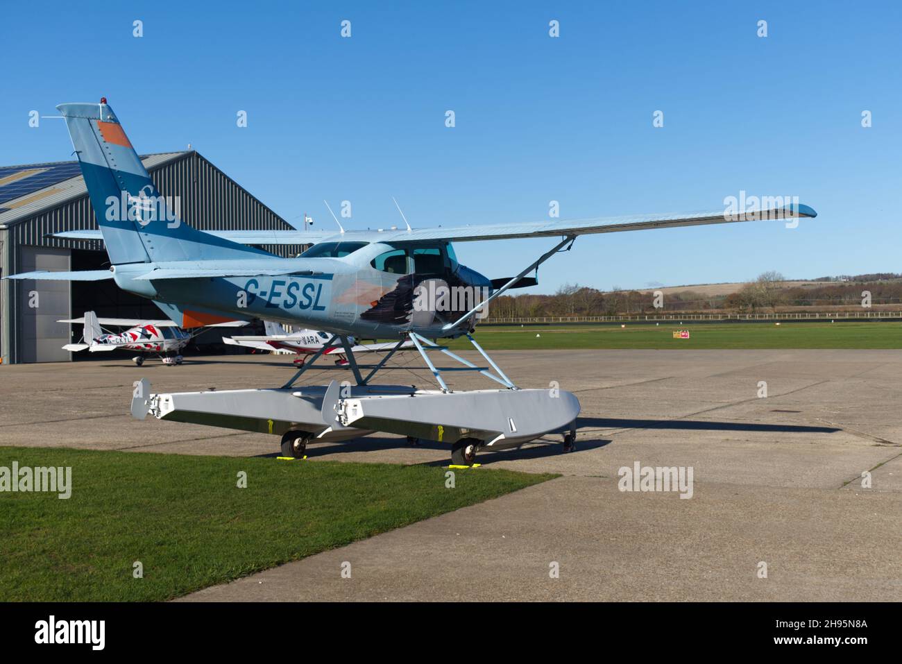 A Cessna 182R Skylane Float plane registered G=ESSL parked on the apron at Goodwood Aerodrome. Stock Photo