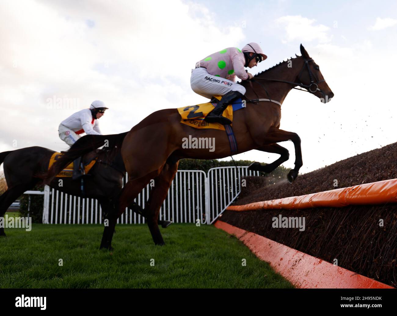 Chacun Pour Soi (right) ridden by jockey Patrick Mullins jump a fence while riding in the Betfair Tingle Creek Chase during the Betfair Tingle Creek Festival at Sandown Park Racecourse, Esher. Picture date: Saturday December 4, 2021. Stock Photo