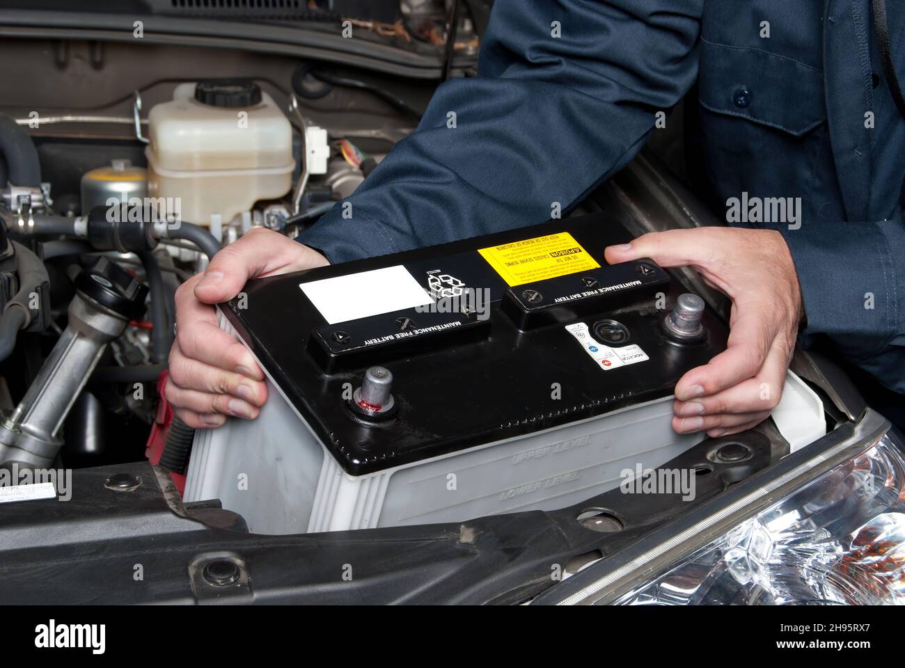 Vehicle battery installation Stock Photo - Alamy