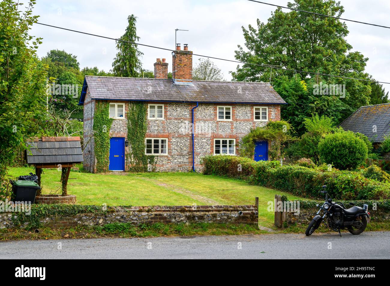 A traditional old flint and brick cottage in Farnham, Dorset, England